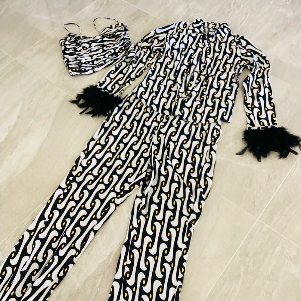 Stylish Black and White Patterned Outfit with Feather Details